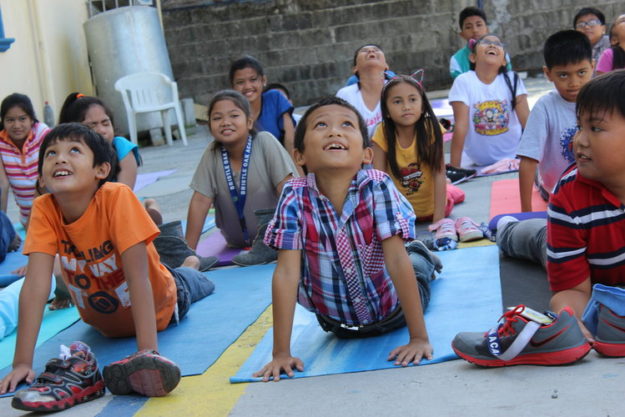 Kids at a Let's Imagine yoga camp
